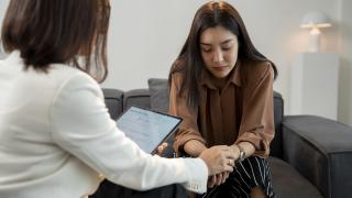 image of a doctor speaking with a young woman