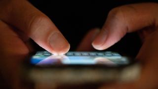Close up of person using an app on their phone