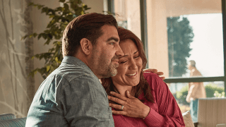 Couple speaking to a doctor about survivorship programs