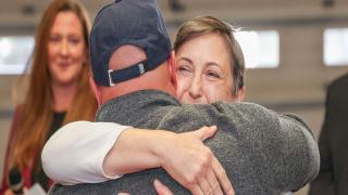BMT donor and recipient embracing