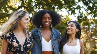 Three women walking together outdoors