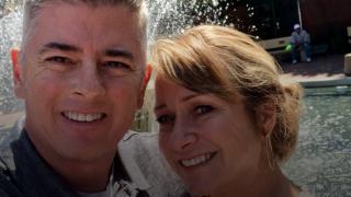 Brent and his company in front of the Spirit of Life fountain