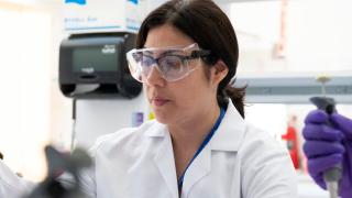 Female Scientist with Goggles in Lab