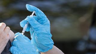 COVID vaccine faqs hero image BLUE GLOVE