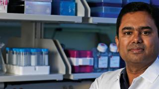 Sampath Rangasamy in lab coat