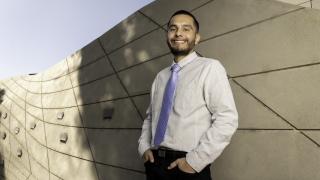 Young stomach cancer survivor Jason Diaz smiling confidently