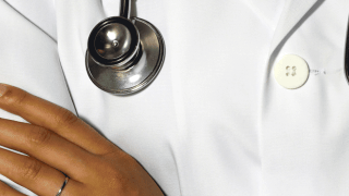 Physician expert with arms crossed
