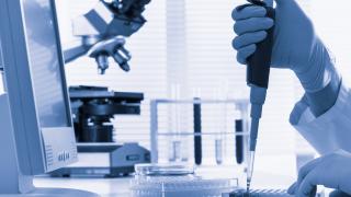 ASCO Molecular oncology researcher syringe stock - large hi res