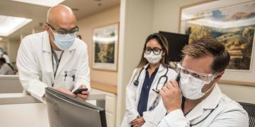 A group of City of Hope doctors providing patient care together