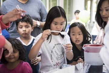 young girl in a science fair