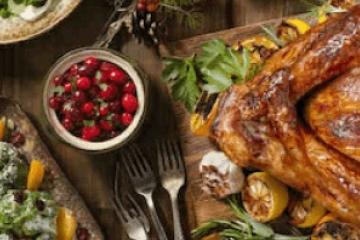 Cooked turkey and jam on table full of food