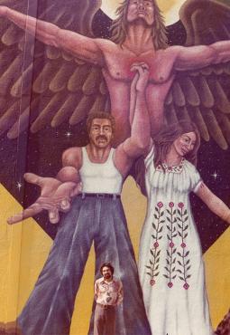 joe-bravo-in-front-of-a-mural