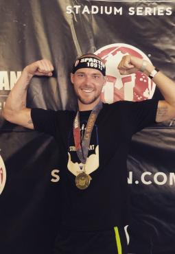 Michael Davies posing with medal
